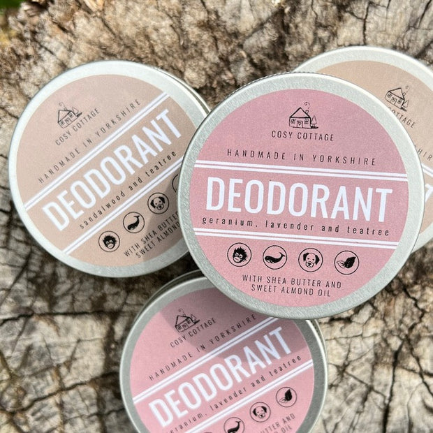 natural deodorant pots on a log