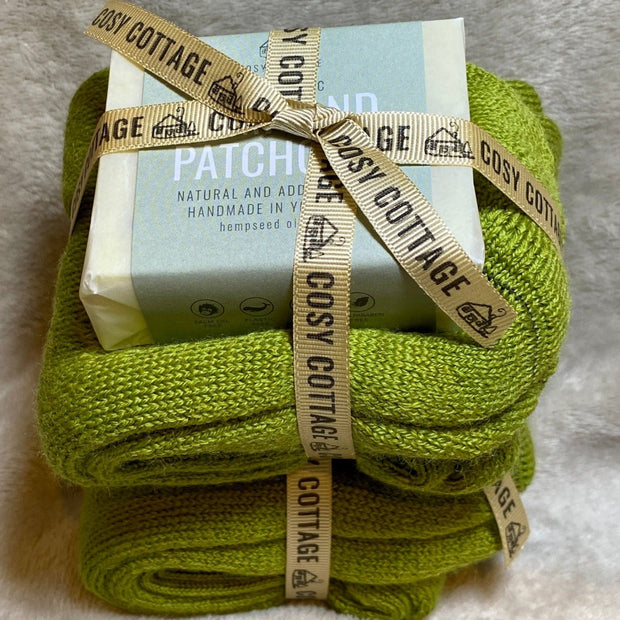 110g Cosy Cottage hemp and patchouli soap and green woollen socks tied in bundles with Cosy Cottage ribbon