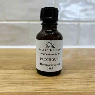 patchouli essential oil on wooden worktop