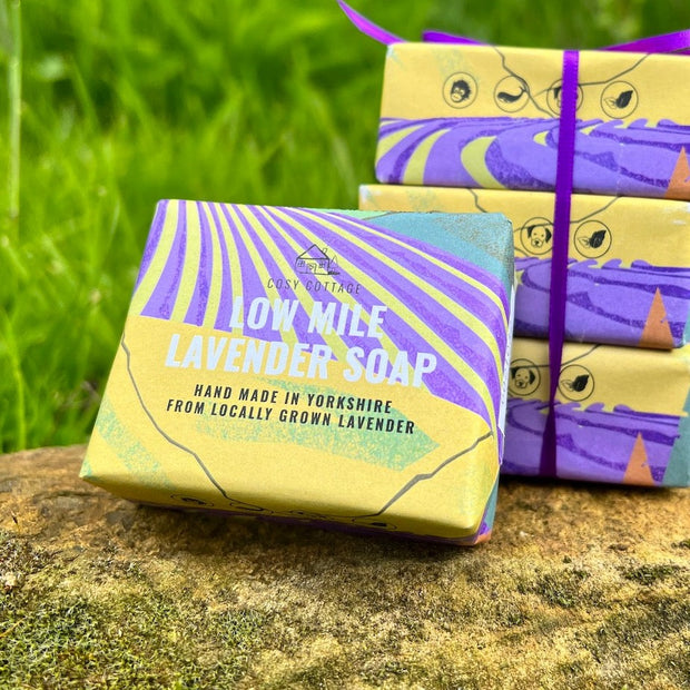 low mile lavender cosy cottage soaps on a stone with grass in the background