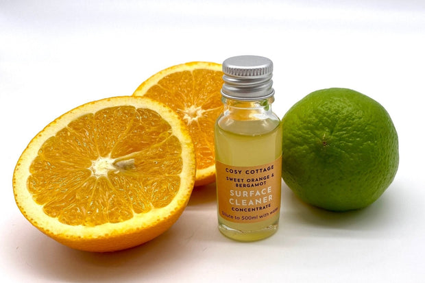 15ml bottle of biodegradable surface cleaner with oranges and bergamot on a white background