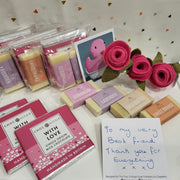 soaps and chocolate bars with a message card and felt roses