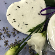 heart shaped lavender bath bomb with lavender flowers