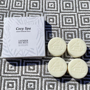 cosy cottage lavender wax melts on a square patterned towel