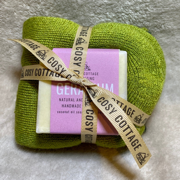 55g Cosy Cottage geranium soap with Yorkshire made green woollen socks tied into a bundle