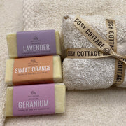 Three Cosy Cottage 20g soaps with cotton washcloth  wrapped in a parcel