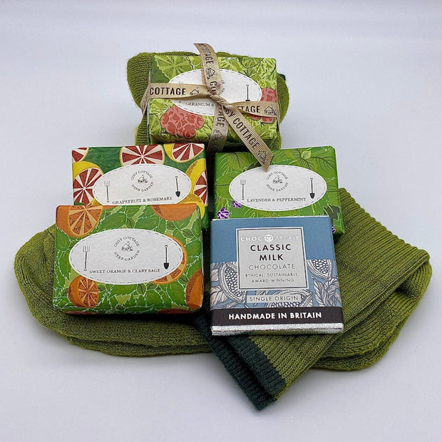 Cosy Cottage herb garden soaps with green woollen socks and 30g bar of milk chocolate