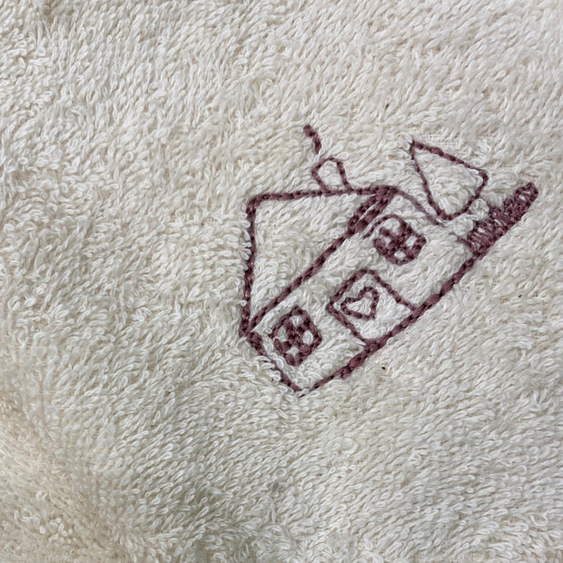 Cosy Cottage logon stitched on baby towel