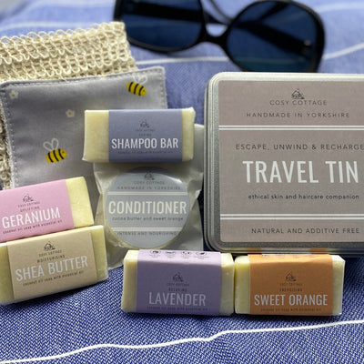 Cosy Cottage travel tin with travel size soaps, shampoo, conditioner, sisal bag and cotton face wipe