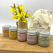 Cosy Cottage hand, body and foot creams in gklass jars with cotton drawstring bag and yellow flowers