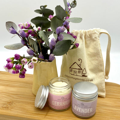Cosy Cottage geranium cream and lavender cream in 30ml glass jars with Cosy Cottage branded cotton drawstring bag