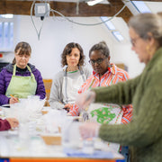group of women learning to make soap