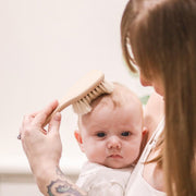 Cosy Cuddles baby hairbrush with baby and mum