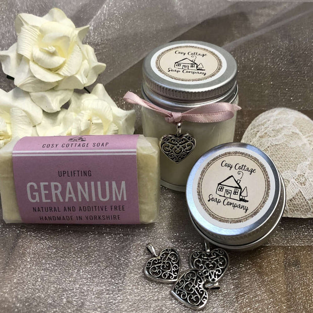 uplifting geranium travel soap, soy wax candle and lip balm with love heart pendants