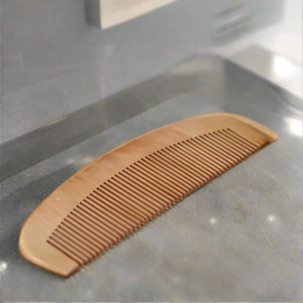 bamboo hair comb on wooden bench 